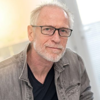 Portrait of mature man looking the camera, light effect