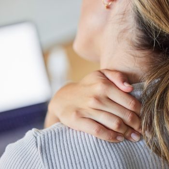 Business woman, stress and laptop with neck pain, tired and injury from working or strain in office. Burnout, overworked and stressed female worker massage sore, ache and muscle in neck in workplace