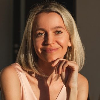 Attractive Middle aged woman smiling at the camera at home. Happy 40s lady in living room