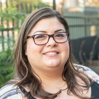 Smiling mid adult overweight woman looking at the camera