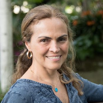 Smiling hispanic woman looking at the camera