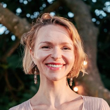 Awesom pretty blonde mature woman looking at camera smiling at sunset in the back yard. High quality photo